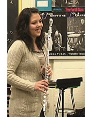 Flutist Sachi Angel prepares for a performance before Beth Dykeman's music class at St. Anne's Catholic High School